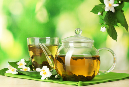 green tea with jasmine in cup and teapot